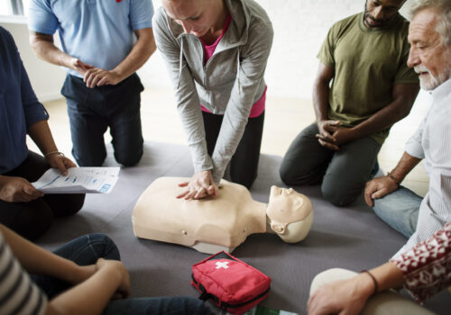 Group of diverse people in cpr training class